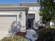 Tan house with a two-car garage and screened porch at 2824 47Th E St, Palmetto, FL 34221