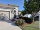 Tan house with a two-car garage and landscaped yard at 2824 47Th E St, Palmetto, FL 34221