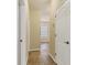 Clean hallway with tile floors and neutral walls at 2824 47Th E St, Palmetto, FL 34221