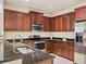 Modern kitchen with dark wood cabinets and granite countertops at 2824 47Th E St, Palmetto, FL 34221