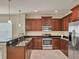 Modern kitchen with dark wood cabinets and granite countertops at 2824 47Th E St, Palmetto, FL 34221