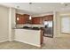 Modern kitchen with dark wood cabinets and granite countertops at 2824 47Th E St, Palmetto, FL 34221