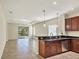 Kitchen with dark wood cabinets and granite countertops at 2824 47Th E St, Palmetto, FL 34221