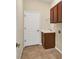 Laundry room with cabinets, utility sink and built in shelving at 2824 47Th E St, Palmetto, FL 34221