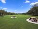 Green grassy park with picnic tables and benches at 2824 47Th E St, Palmetto, FL 34221