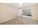 Bright bedroom with carpet flooring and sliding glass doors leading to a patio at 2925 29Th W Ave, Bradenton, FL 34205