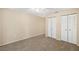 Spacious bedroom with neutral carpeting and double closets at 2925 29Th W Ave, Bradenton, FL 34205