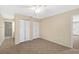 Bedroom featuring neutral carpeting, double closets, and bathroom access at 2925 29Th W Ave, Bradenton, FL 34205