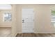 Interior entryway with white door and wood floors at 2925 29Th W Ave, Bradenton, FL 34205