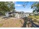 Exterior view of the property showing a fenced backyard and landscaping at 2925 29Th W Ave, Bradenton, FL 34205