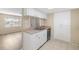 Kitchen with stainless steel appliances and view into living area at 2925 29Th W Ave, Bradenton, FL 34205