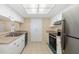 Efficient kitchen with stainless steel appliances and ample cabinet space at 2925 29Th W Ave, Bradenton, FL 34205