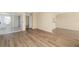 Bright living room with wood-look floors and sliding glass doors leading to a screened patio at 2925 29Th W Ave, Bradenton, FL 34205