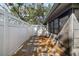 Private patio with wood chips, small garden, and privacy fence at 2925 29Th W Ave, Bradenton, FL 34205