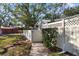 Landscaped side yard with a gate and fence at 2925 29Th W Ave, Bradenton, FL 34205