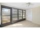 Sunroom with tile floors, sliding glass door, and neutral walls at 2925 29Th W Ave, Bradenton, FL 34205