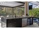 Modern outdoor bar with beverage taps and a built-in fridge at 3407 155Th E Ave, Parrish, FL 34219