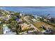 Aerial view of a yellow house near the water at 343 S Orchid Dr, Ellenton, FL 34222