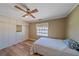 Cozy bedroom with wood-look floors and a full-size bed at 3471 Clarinda St, Sarasota, FL 34239