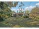 Landscaped backyard with screened enclosure at 349 Scott Ave, Sarasota, FL 34243