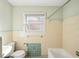 Clean bathroom with light-colored tile and bathtub at 349 Scott Ave, Sarasota, FL 34243