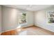 Spacious bedroom with hardwood floors and multiple windows at 349 Scott Ave, Sarasota, FL 34243