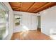 Bedroom with hardwood floors, wood ceiling and window at 349 Scott Ave, Sarasota, FL 34243