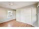 Bedroom featuring hardwood floors and double door closet at 349 Scott Ave, Sarasota, FL 34243