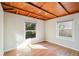 Bright bedroom with hardwood floors and two large windows at 349 Scott Ave, Sarasota, FL 34243