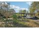 Ranch style home with carport and mature landscaping at 349 Scott Ave, Sarasota, FL 34243