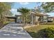 Mid-century modern home with carport and screened porch at 349 Scott Ave, Sarasota, FL 34243