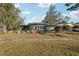 Gray mid-century modern house with a landscaped front yard at 349 Scott Ave, Sarasota, FL 34243