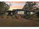 House exterior at sunset, nicely landscaped at 349 Scott Ave, Sarasota, FL 34243