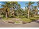 Landscaped corner lot with lush tropical plants at 349 Scott Ave, Sarasota, FL 34243