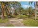 Landscaped corner lot with lush tropical plants at 349 Scott Ave, Sarasota, FL 34243