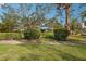 Mature trees and landscaping around home at 349 Scott Ave, Sarasota, FL 34243