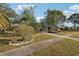 Attractive Florida home with a well-manicured lawn and mature trees at 349 Scott Ave, Sarasota, FL 34243