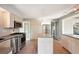 Modern kitchen with island and view to backyard at 349 Scott Ave, Sarasota, FL 34243