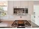 Modern kitchen features stainless steel appliances at 349 Scott Ave, Sarasota, FL 34243