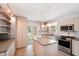 Updated kitchen with island and stainless steel appliances at 349 Scott Ave, Sarasota, FL 34243
