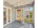 Sunroom with French doors opening to the living area and backyard at 349 Scott Ave, Sarasota, FL 34243
