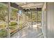 Bright and airy sunroom with ample natural light and a ceiling fan at 349 Scott Ave, Sarasota, FL 34243