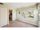 Bright sunroom with tile floors and view of backyard at 349 Scott Ave, Sarasota, FL 34243