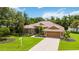 Single-story house with tile roof and lush green landscaping at 3861 Royal Hammock Blvd, Sarasota, FL 34240