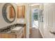 Guest bathroom with granite vanity and pool view at 3861 Royal Hammock Blvd, Sarasota, FL 34240