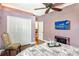 Guest bedroom with hardwood floors and a flat-screen TV at 3861 Royal Hammock Blvd, Sarasota, FL 34240