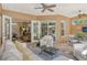 Relaxing covered patio with comfortable seating and access to the interior at 3861 Royal Hammock Blvd, Sarasota, FL 34240