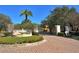 Community entrance with gated entry and fountain at 3861 Royal Hammock Blvd, Sarasota, FL 34240