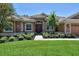 Home exterior with double doors and manicured landscaping at 3861 Royal Hammock Blvd, Sarasota, FL 34240