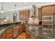 Well-equipped kitchen, featuring granite countertops and wood cabinets at 3861 Royal Hammock Blvd, Sarasota, FL 34240